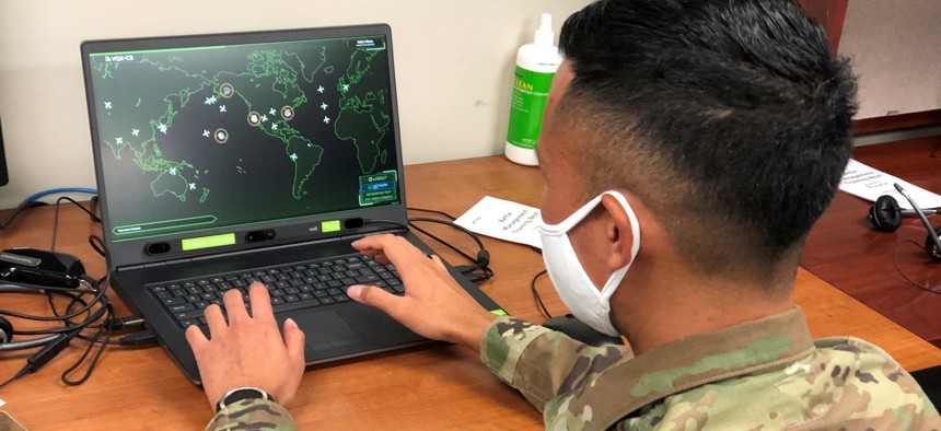 U.S. Air Force Master Sgt. Shane Keahiolalo, 169th Air Defense Squadron, Hawaii Air National Guard, tests a new training system that includes artificial intelligence, machine learning, and biometric capabilities, at Joint Base Lewis-McChord, Washington, Aug. 26, 2021. 
