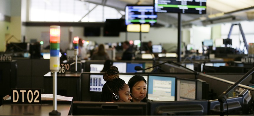 In this photo taken Aug. 2, 2019, is the 9-1-1 call center at the San Francisco Department of Emergency Management in San Francisco. 
