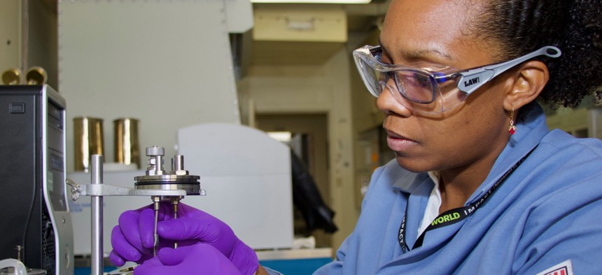 Dr. Josanne Woodroffe, a research chemist at Naval Air Warfare Center Weapons Division, measures the heat of combustion of a fuel sample on Feb. 28 at China Lake. Woodroffe’s work supports NAWCWD’s collaborative efforts to convert biosynthetic molecules into high density fuels.