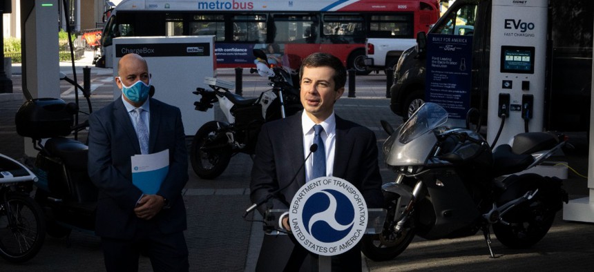 Transportation Secretary Pete Buttigieg speaks during an electric vehicles event outside of the agency’s Washington headquarters in October.