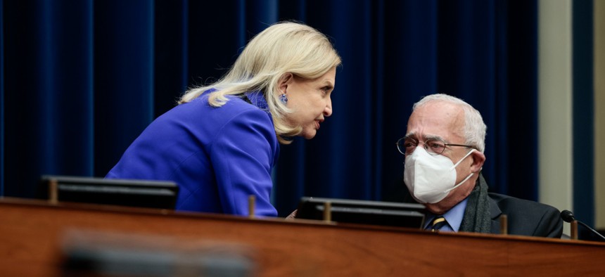 Chairwoman Carolyn Maloney (D-N.Y.) and Rep. Gerry Connolly (D-Va.) confer at a Nov. 16 hearing of the House Committee on Oversight and Reform