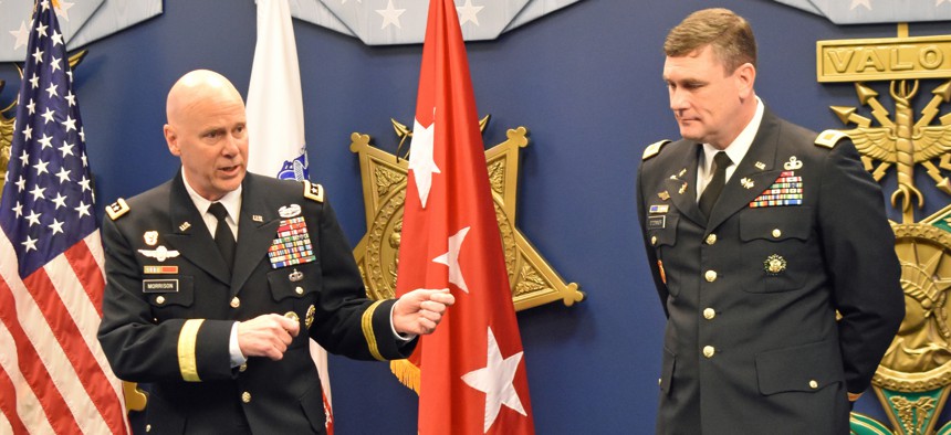 Lt. Gen. John B. Morrison, Jr. (left) speaks at the retirement ceremony of Col. Christopher M. O'Connor (right).