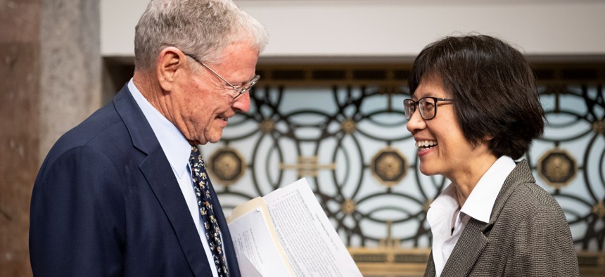 Heidi Shyu, Defense undersecretary for research and engineering, talks to Sen. Jim Inhofe (R-Okla.) before her confirmation hearing, May 25, 2021