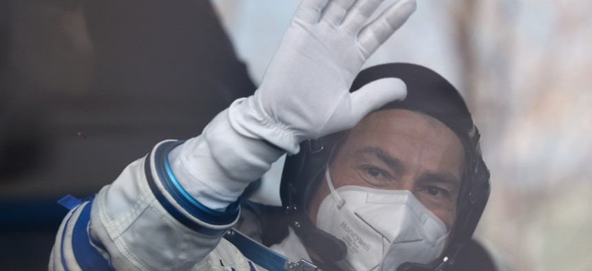 NASA astronaut Mark Vande Hei of the ISS Expedition 65 prime crew waves his hand as he leaves for the launch of a Soyuz-2.1a rocket booster carrying the Soyuz MS-18 Yuri Gagarin spacecraft from Baikonur Cosmodrome. 
