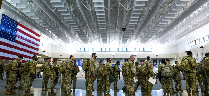 Members of the 1st Armored Brigade Combat Team, 3rd Battalion, 69th Armored Regiment arrive for deployment to Germany, March 2, 2022. 