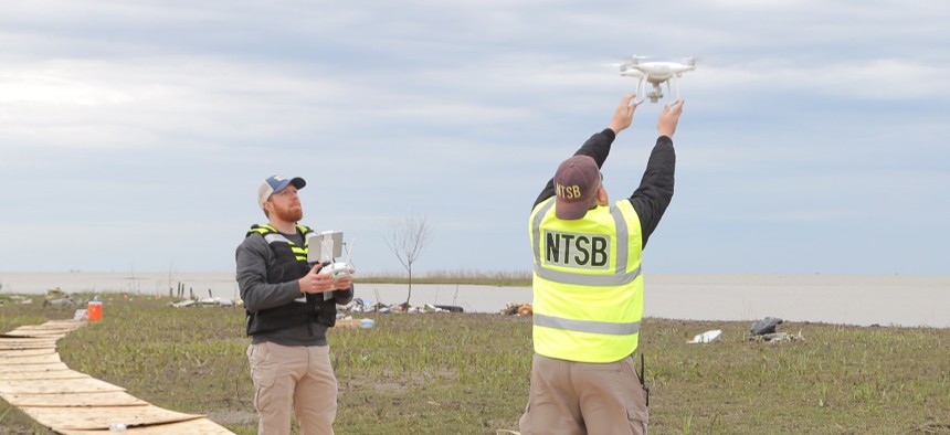 In this photo taken Feb. 25, 2019, NTSB investigators launch a drone to survey debris field of the Feb. 23, 2019, cargo jet crash in Texas.