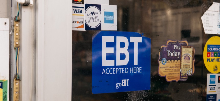  A sign alerting customers about SNAP food stamps benefits is displayed at a Brooklyn grocery store on December 5, 2019 in New York City. 