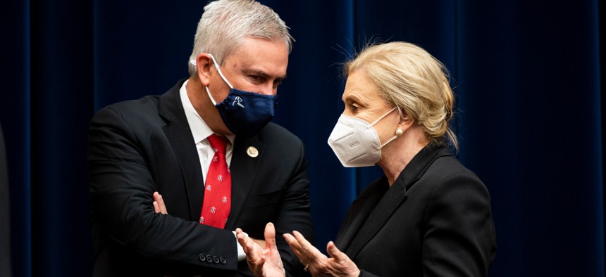 Reps. James Comer and Carolyn Maloney confer before the start of a May 2021 hearing of the House Committee on Oversight and Reform.