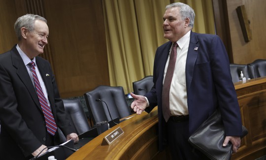 WASHINGTON, DC - APRIL 07: Commissioner of the Internal Revenue Service (IRS) Charles Rettig (R) talks to Sen. Mike Crapo (R-ID) as he arrives to testify before the Senate Finance Committee on Capitol Hill, April 07, 2022 in Washington, DC. Rettig testified on the 2022 filing season and the President's proposed fiscal year 2023 budget request for the IRS.