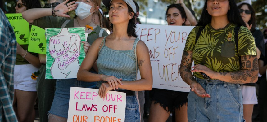 Protesters gather Sunday in Grand Park in Los Angeles at a rally organized by The Feminist Front and Generation Ratify protesting the U.S. Supreme Court's decision to overturn federal abortion protections provided under Roe v. Wade. 