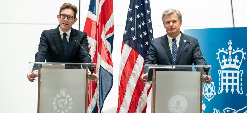 MI5 Director General Ken McCallum (left) and FBI Director Christopher Wray at a joint press conference at MI5 headquarters, in London, July 6, 2022.