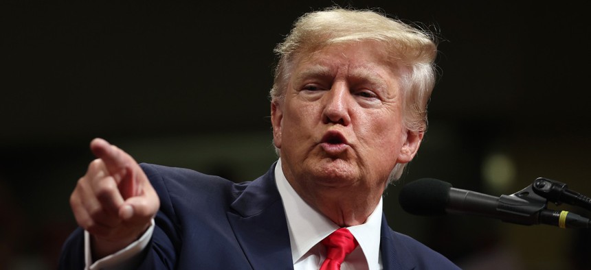 Former President Donald Trump speaks during a "Save America" rally at Alaska Airlines Center on July 09, 2022 in Anchorage. His aides have identified 50,000 current federal employees to dismiss under the new authority they seek to create. 