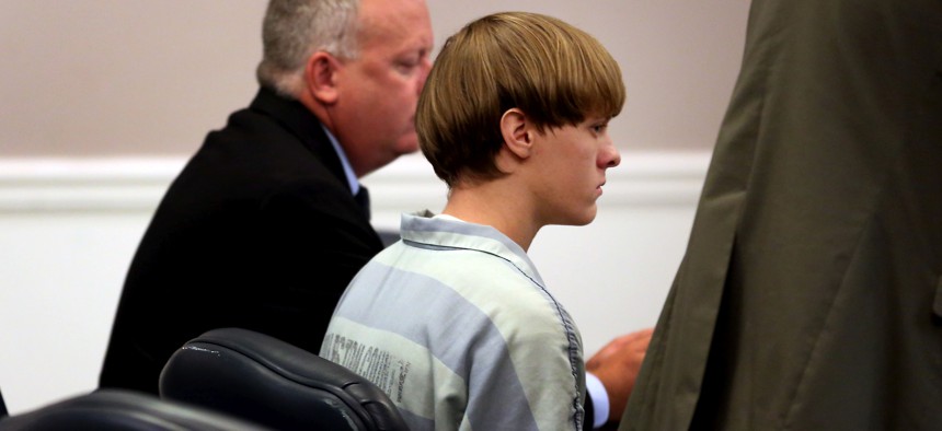CHARLESTON, SC - JULY 16: Dylan Roof (C), the suspect in the mass shooting that left nine dead in a Charleston church last month, appears in court July 18, 2015 in Charleston, South Carolina. The Associated Press, WCIV-TV and The Post and Courier of Charleston are challenging a judge's order issued last week that prohibits the release of public records in the June 17 shooting at Emanuel African Methodist Episcopal church.