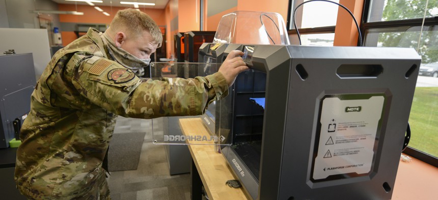 U.S. Air Force Airman 1st Class Christopher Young, a 3rd Munitions Squadron munitions support equipment maintenance crew chief, uses the 3D printer in the Arctic Spark Lab at Joint Base Elmendorf-Richardson, Alaska, Aug. 26, 2021. 