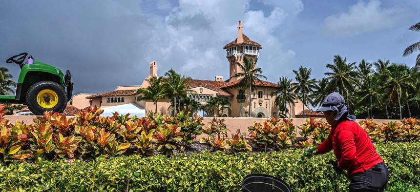 A landscape worker in front of the Palm Beach, Florida, house where FBI agents carried out a search warrant against Donald Trump in early August.