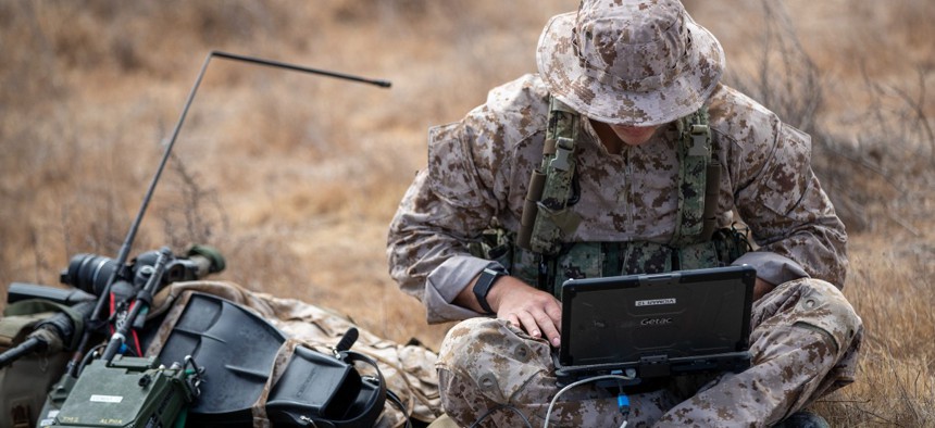 A Naval Special Warfare (NSW) operator establishes a connection during a communications course at Advanced Training Command, a component of Naval Special Warfare Center.