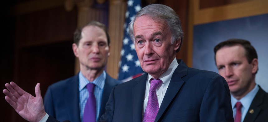 : From left, Sens. Ron Wyden, D-Ore., Ed Markey, D-Mass., and Chris Murphy, D-Conn., conduct a news conference in the U.S. Capitol building.