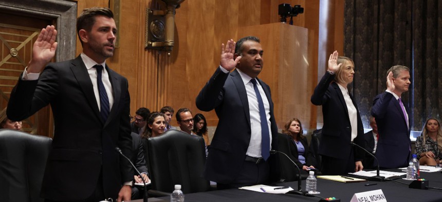  (L-R) Chief Product Officer of Meta Chris Cox, Chief Product Officer of YouTube Neal Mohan, Chief Operating Officer of TikTok Vanessa Pappas, and General Manager of Bluebird of Twitter Jay Sullivan are sworn in during a hearing before Senate Homeland Security and Governmental Affairs Committee September 14, 2022 in Washington, DC.