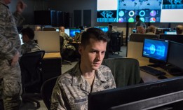 Tech. Sgt. Kyle Hanslovan, a cyber-warfare specialist serving with the 175th Cyberspace Operations Group of the Maryland Air National Guard, works in the Hunter's Den at Warfield Air National Guard Base, Middle River, Md., Dec. 2, 2017.