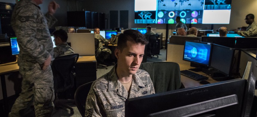 Tech. Sgt. Kyle Hanslovan, a cyber-warfare specialist serving with the 175th Cyberspace Operations Group of the Maryland Air National Guard, works in the Hunter's Den at Warfield Air National Guard Base, Middle River, Md., Dec. 2, 2017.