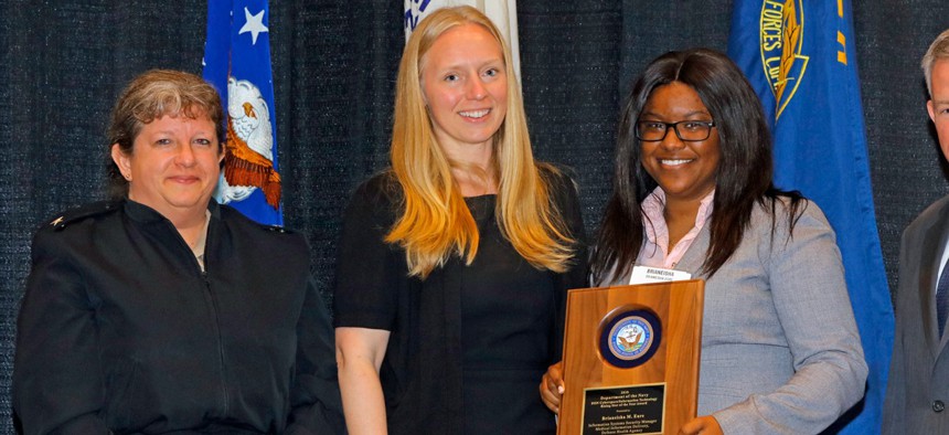 Dr. Kelly Fletcher (center) at the presentation of the DON Information Management/Information Technology (IM/IT) Excellence Award.