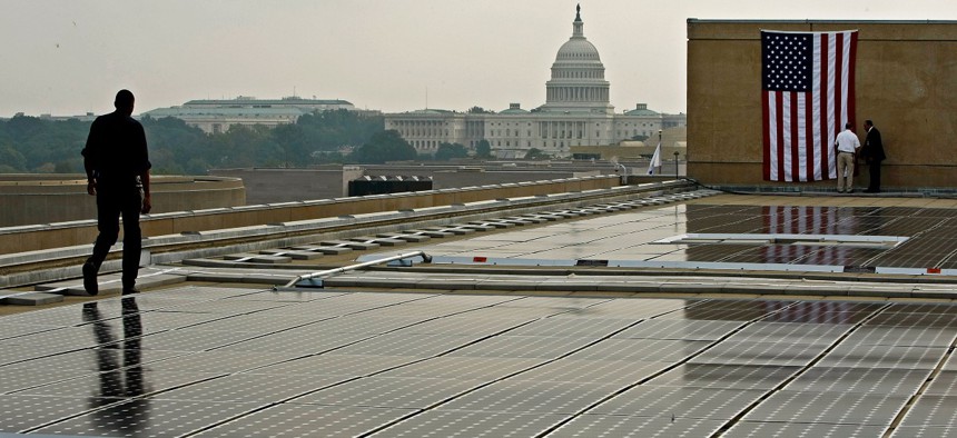 The U.S. Department of Energy unveiled 891 photovoltaic modules on the roof of the the department's Forrestal building roof September 9, 2008 in Washington, DC. 