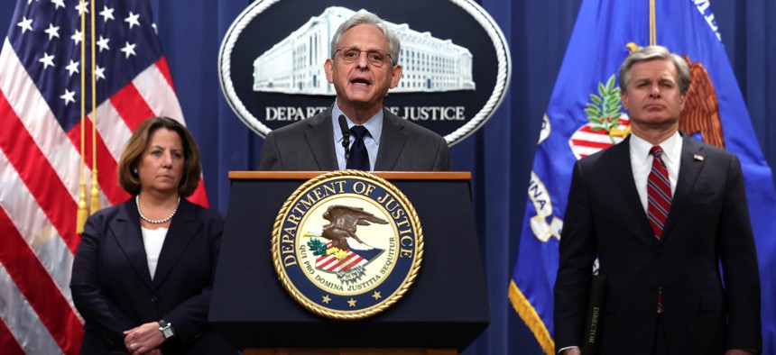 U.S. Attorney General Merrick Garland (C), F.B.I. Director Christopher Wray (R) and Deputy Attorney General Lisa Monaco hold a press conference at the U.S. Department of Justice on on October 24, 2022 in Washington, DC. The Justice Department announced it has charged 13 individuals, including members of the Chinese intelligence and their agents, for alleged efforts to unlawfully exert influence in the United States for the benefit of the government of China.