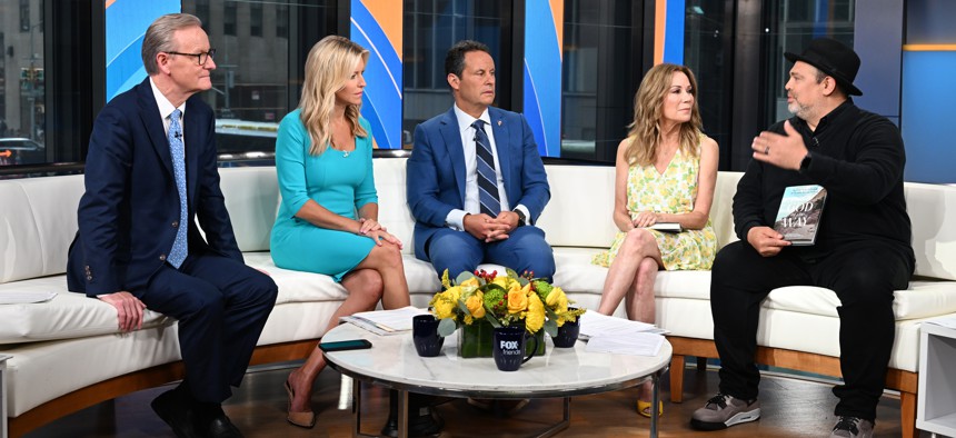 NEW YORK, NEW YORK - AUGUST 30: (L-R) FOX and Friends hosts Steve Doocy, Ainsley Earhardt and Brian Kilmeade talk to Kathie Lee Gifford and Rabbi Jason Sobel at Fox News Channel Studios