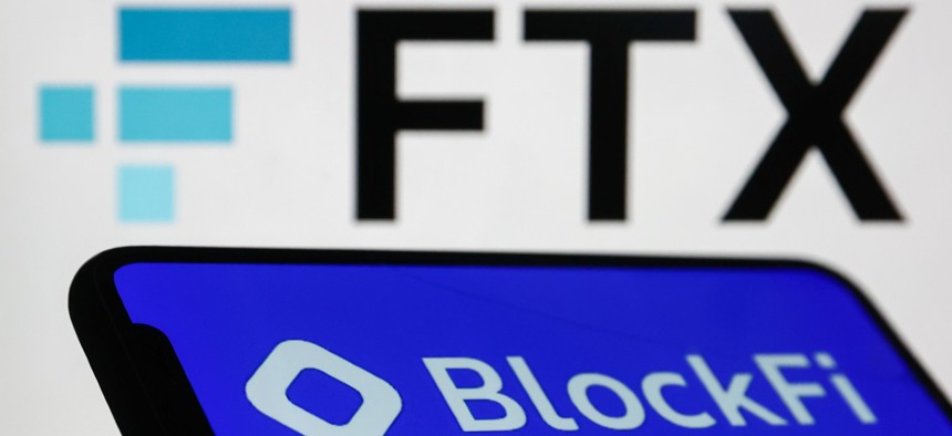 BlockFi logo displayed on a phone screen and FTX logo displayed on a laptop screen are seen in this illustration photo taken in Krakow, Poland on November 14, 2022. 
