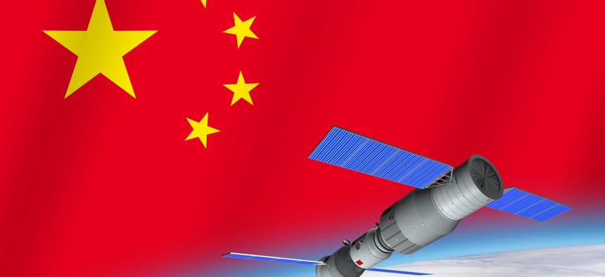 3D model of China's Tiangong-1 space station orbiting the planet Earth with the flag of China in the background. 3D rendering