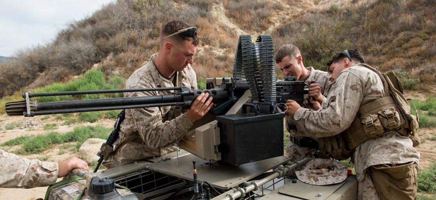 In this 2016 photo, Marines with the 5th Marines Regiment prepare the robotic Multi Utility Tactical Transport for testing at Marine Corps Base Camp Pendleton, Calif.