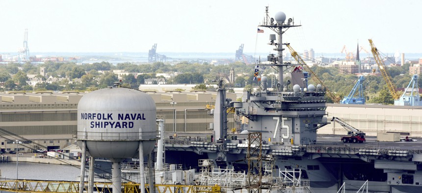 The aircraft carrier USS Harry S. Truman arrives for an overhaul at Norfolk Naval Shipyard in Virginia in 2016.