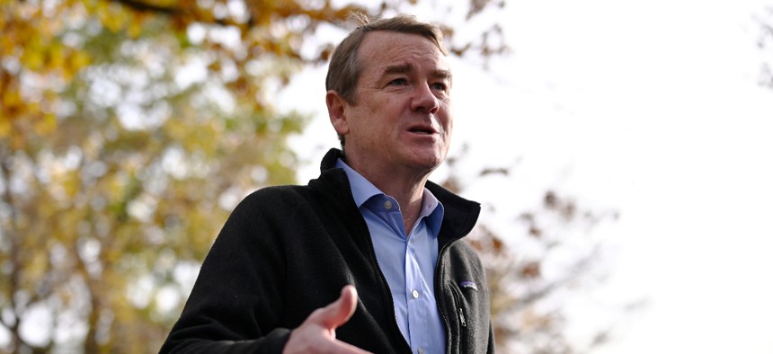  Sen. Michael Bennet answers questions from reporters after drop off his ballot at Washington Park in Denver, Colorado on Wednesday, November 2, 2022.