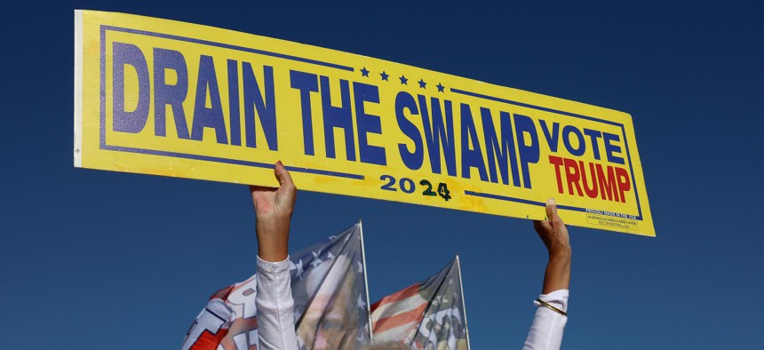 A Trump supporter rallies outside his Mar-a--Lago home on March 21. 