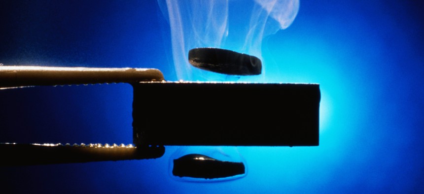 A supercooled superconductor creates magnetic levitation, as well as steam, due to its low temperature.