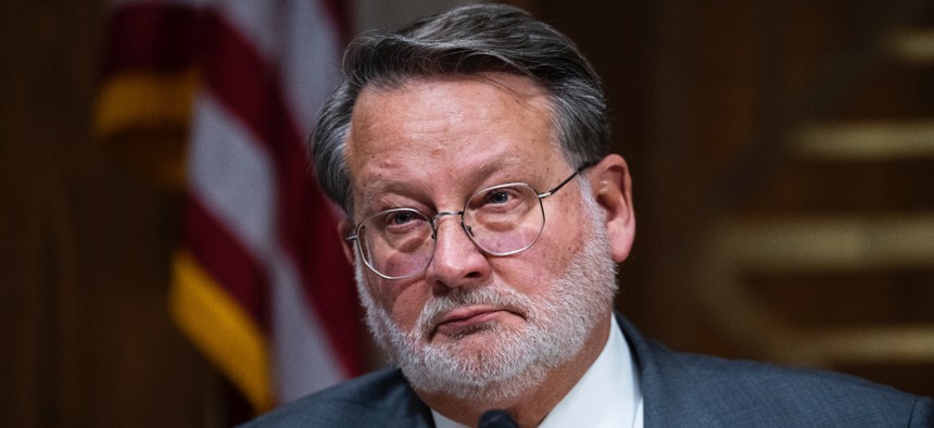 Senate Homeland Security and Governmental Affairs Committee Chairman Gary Peters (D-Mich.) oversaw 24 bills reported out of committee Wednesday, including legislation on open source software and critical infrastructure security. 