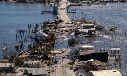 An aerial picture taken on September 30, 2022 shows the only access to the Matlacha neighborhood destroyed in the aftermath of Hurricane Ian in Fort Myers, Florida. NOAA recently announced an update to its model used for predicting storm surge from hurricanes and tropical storms.