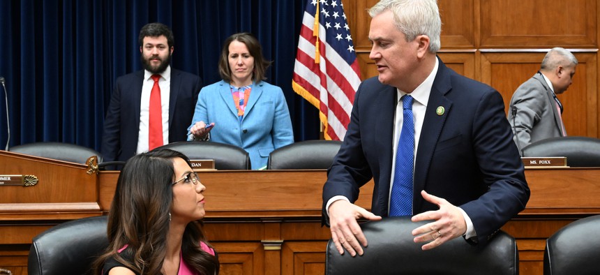 Rep. Lauren Boebert, R-Colo., and  Rep. James Comer, R-Ky.,  chairman of the House Committee on Oversight and Reform, chat before a hearing Feb. 1, 2023. The two, along with Rep. Pete Sessions, R-Texas, sent a letter to agencies demanding updated telework statistics for the agencies’ workforces.