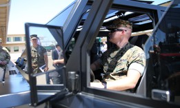 U.S. Marine Corps Gunnery Sgt. Jason Korn, the Marine Corps Air Station Miramar ordnance chief, explores the Bollinger B2 electric pickup truck during the NavalX SoCal Tech Bridge's Electric Mobility Symposium hosted on MCAS Miramar, San Diego, California, June 24, 2021.