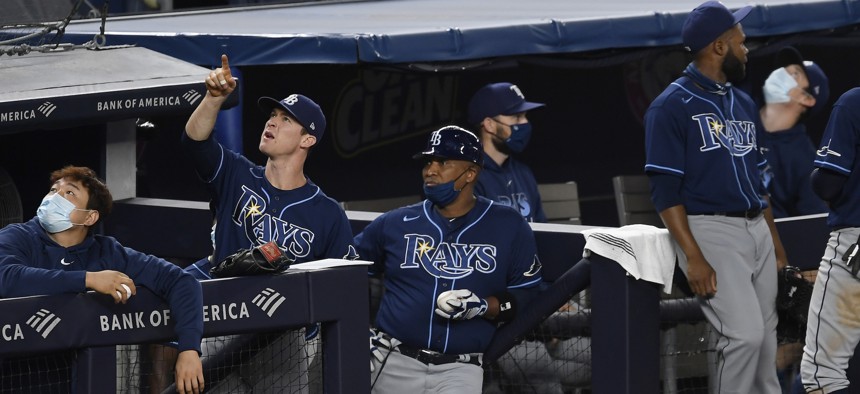 Joey Wendle of the Tampa Bay Rays gestures at an unauthorized drone flying over the field at Yankee Stadium on Sept. 2, 2020. A bipartisan group of lawmakers in the House and Senate is looking to extend and expand federal authority to counter threats from drones.