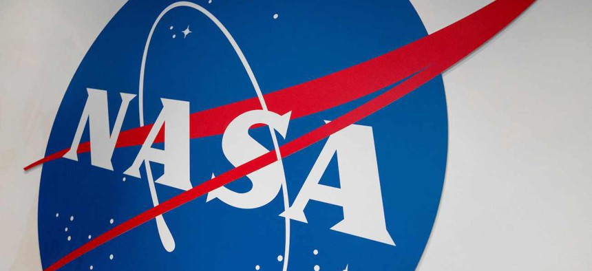 The NASA logo is displayed at the Earth Information Center exhibit, at NASA headquarters on June 21, 2023. NASA's Earth Information Center, which is part physical, part online, is an effort that blends science and visualizations to allow visitors to see how our planet is changing.