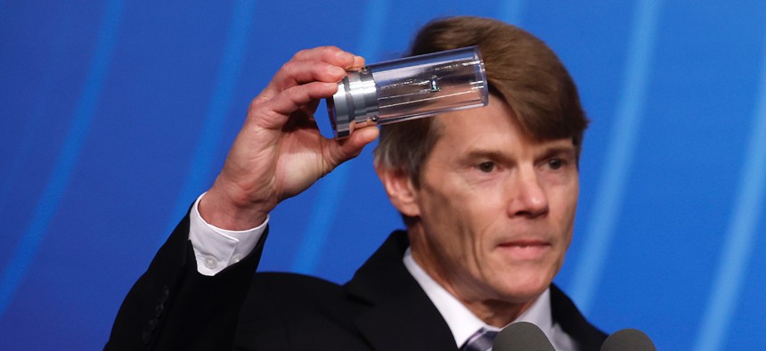 Marvin Adams, NNSA deputy administrator for Defense Programs, holds up a cylinder he says is similar to one used by the Lawrence Livermore National Laboratory for a breakthrough in fusion research in December 2022. Researchers at the laboratory said they repeated the fusion results in July.