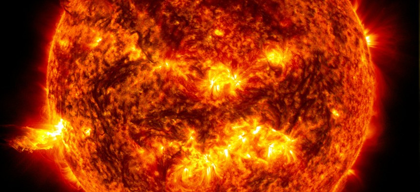 A June 2013 solar flare on the left side of the sun, which later sent a coronal mass ejection out into space.