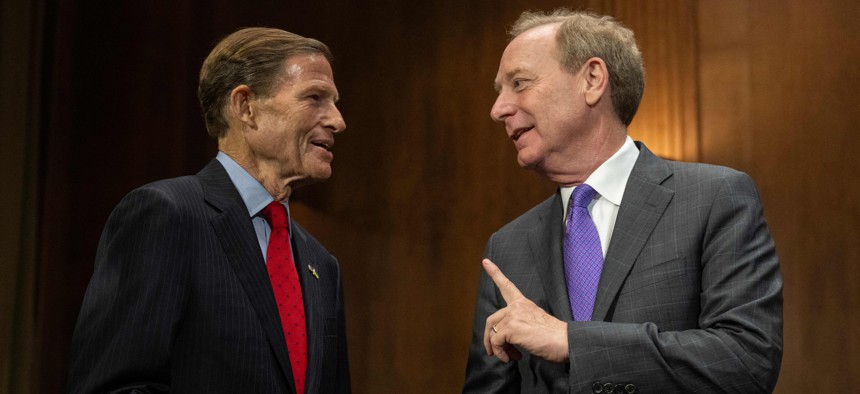 Brad Smith, vice Chair and president at the Microsoft Corporation (R), speaks with U.S. Senator Richard Blumenthal, D-Conn.,  prior to a Senate Judiciary subcommittee hearing on artificial intelligence.