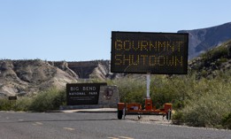 A sign informs visitors driving into Big Bend National Park of the partial government shutdown in 2019.