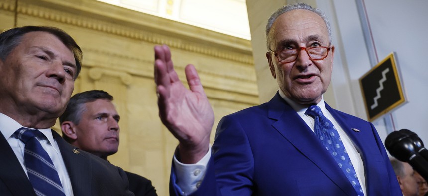 Senate Majority Leader Charles Schumer, D-NY, (R) talks to reporters after he and Sen. Mike Rounds, R-SD, (L) and Sen. Martin Heinrich, D-NM, hosted the closed-door "AI Insight Forum" in the Russell Senate Office Building on Capitol Hill on September 13, 2023.