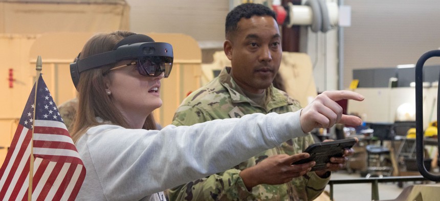 Soldiers of 188th Infantry Brigade demo an virtual reality system at a recruiting event at Fort Stewart in Georgia on December 1, 2022.