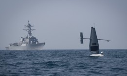A Saildrone Explorer unmanned surface vessel (USV) operates with guided-missile destroyer USS Delbert D. Black (DDG 119) in the Arabian Gulf during exercise Phantom Scope, Oct. 7, 2022.