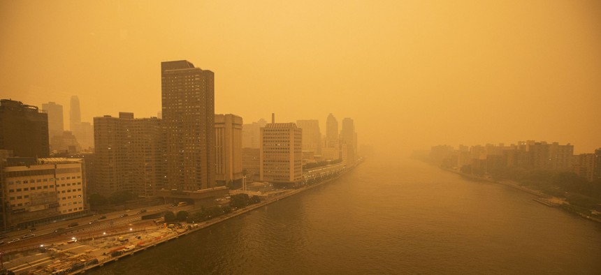 Smoke from Canadian wildfires created hazy conditions over New York City in June 2023. A recent government oversight report says that EPA's air pollution monitoring  IT systems are out of date.