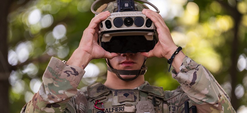 Spc. Layne Alfieri of the U.S. Army's 10th Mountain Division, dons an Integrated Visual Augmentation System (IVAS) 1.2 prototype during tests held by PEO-Soldier on Fort Drum, New York, on August 22, 2023